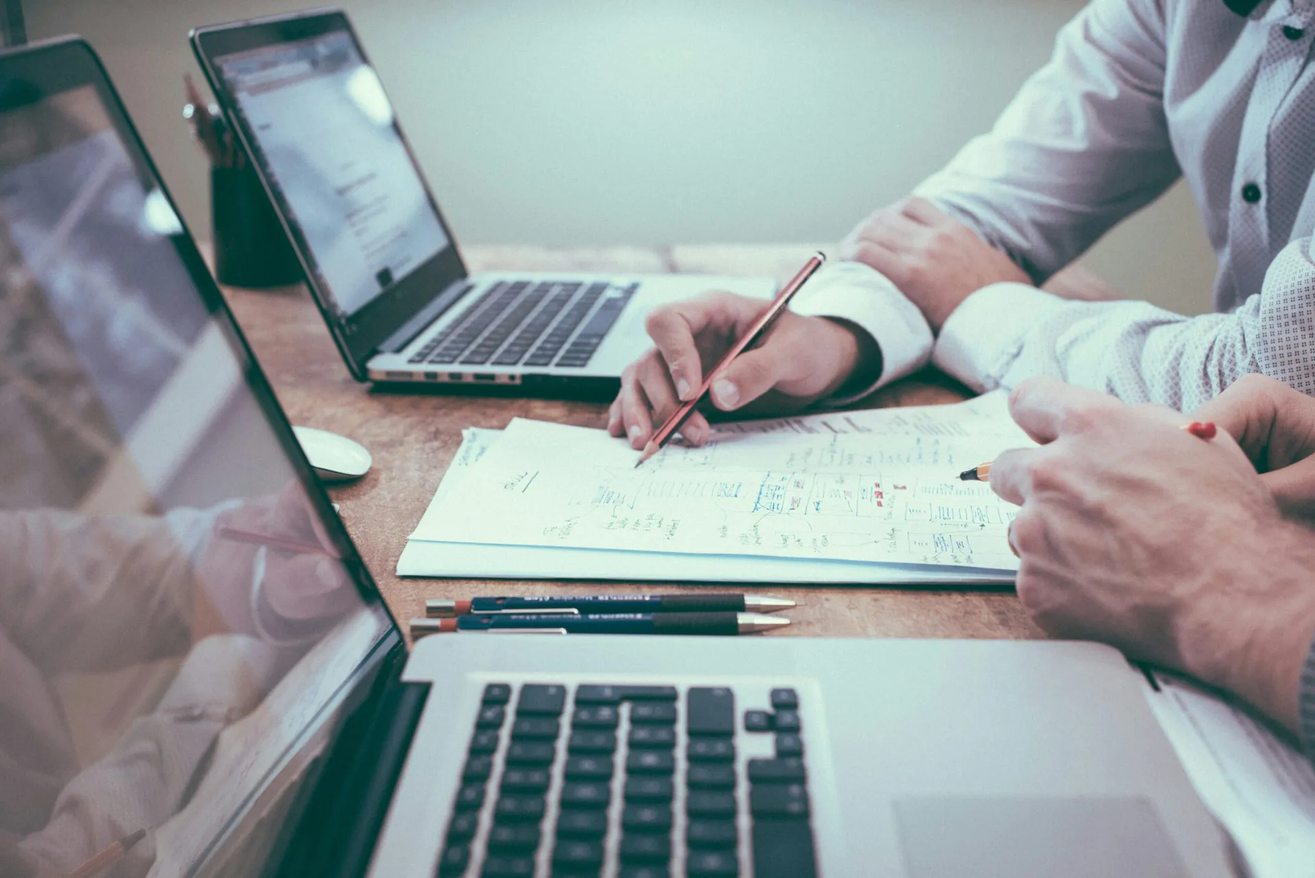 Business owners reviewing financial papers at a desk